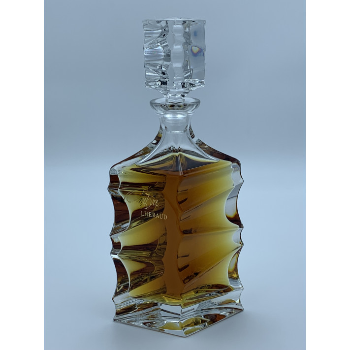 crystal decanter and glass full of strong alcoholic drink, carafe