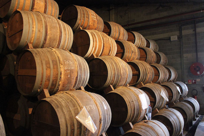 Barrels in a Cognac aging cellar