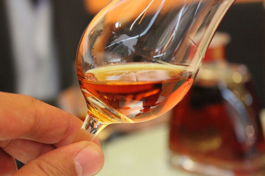 Swirling a glass of Cognac