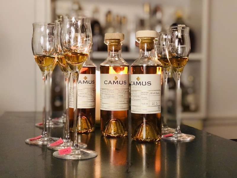 Glasses and bottles of Camus Cognac