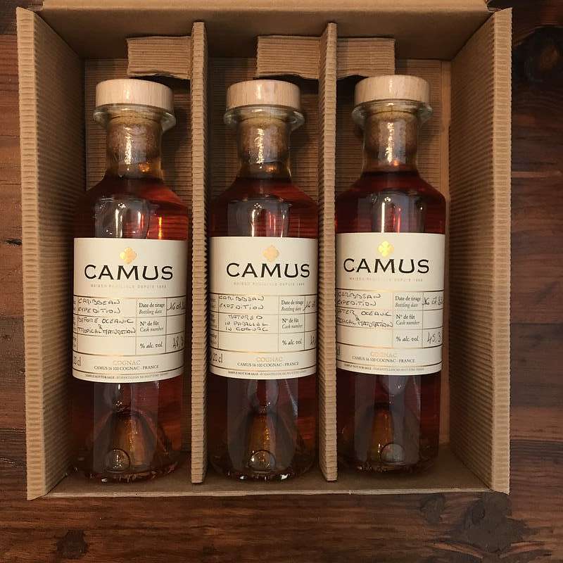 Three small bottles of Camus Cognac