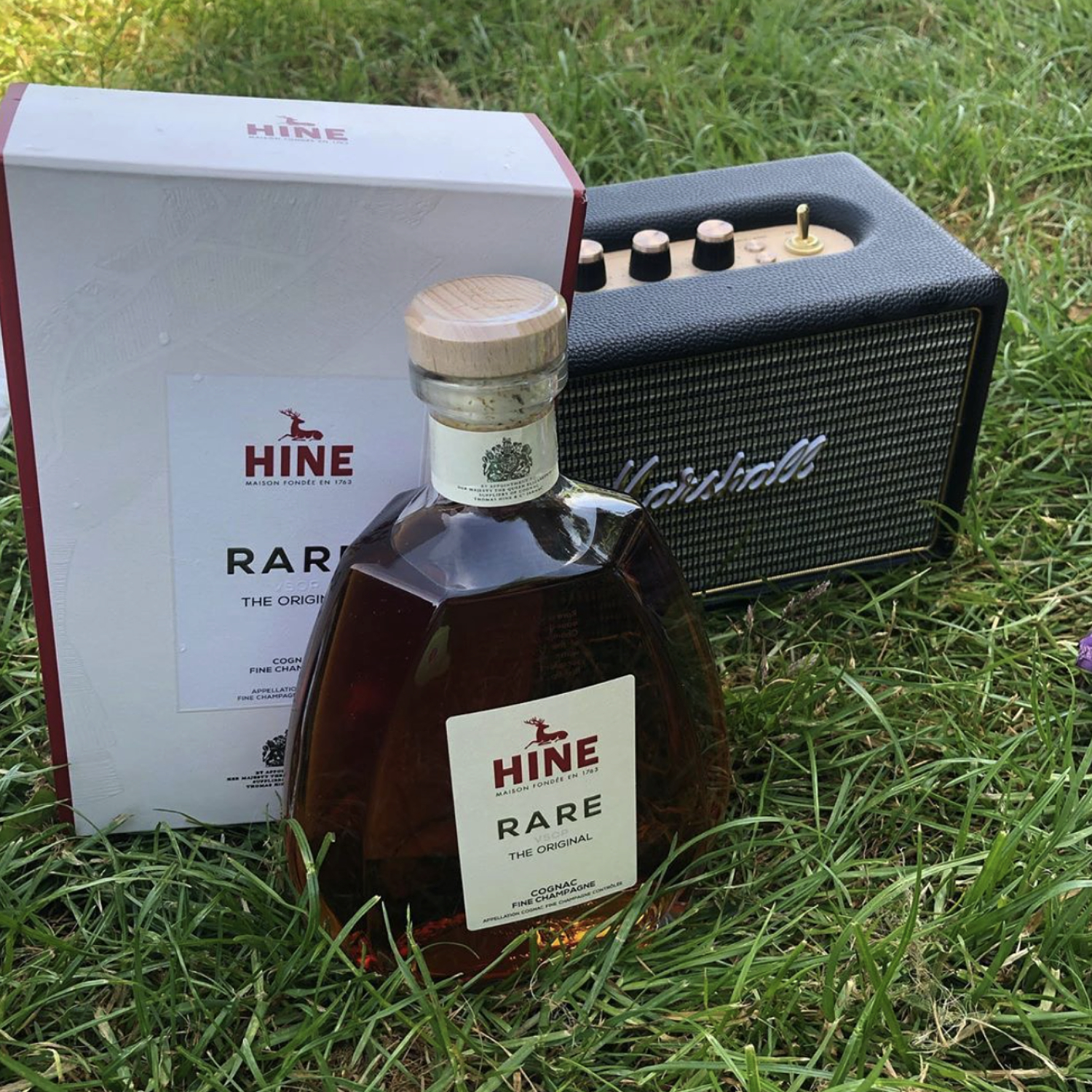 A bottle of Hine Rare next to a Marshall speaker