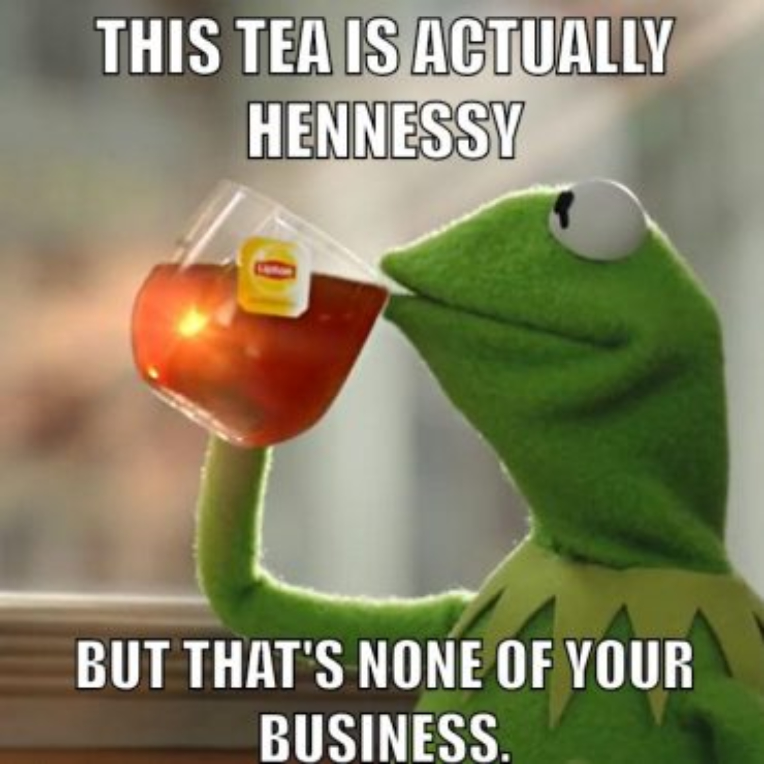 Kermit drinking a cup of Cognac that looks like tea